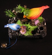 song birds on a rock and log